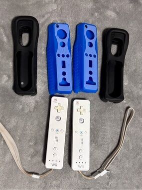 Nintendo Wii Remote Controllers with Blue and Black Silicone Covers